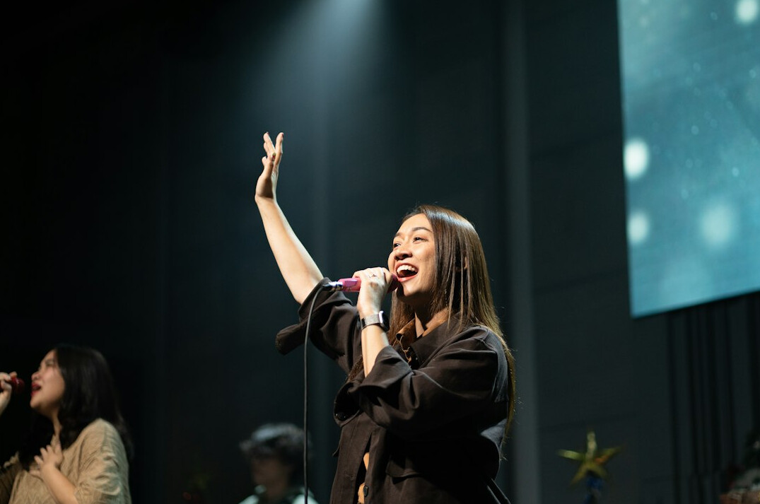 woman smiling on stage