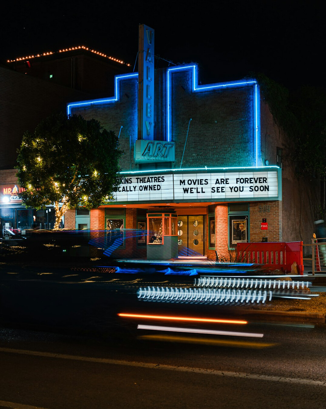 Empty cinema hall with red seats